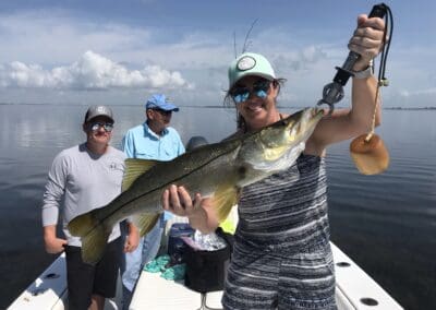 man holding a fish caught on a Seein Red Sportfishing Charter