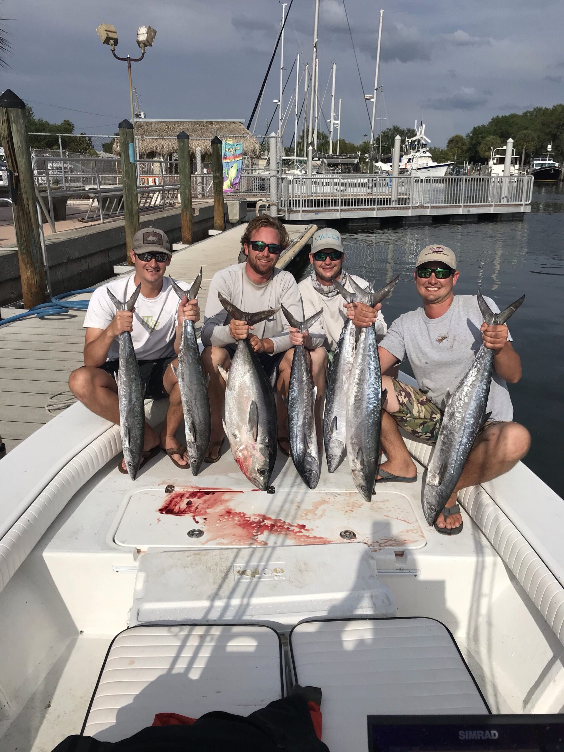 3 clients holding 2 fish a piece  they catch while inshore fishing 