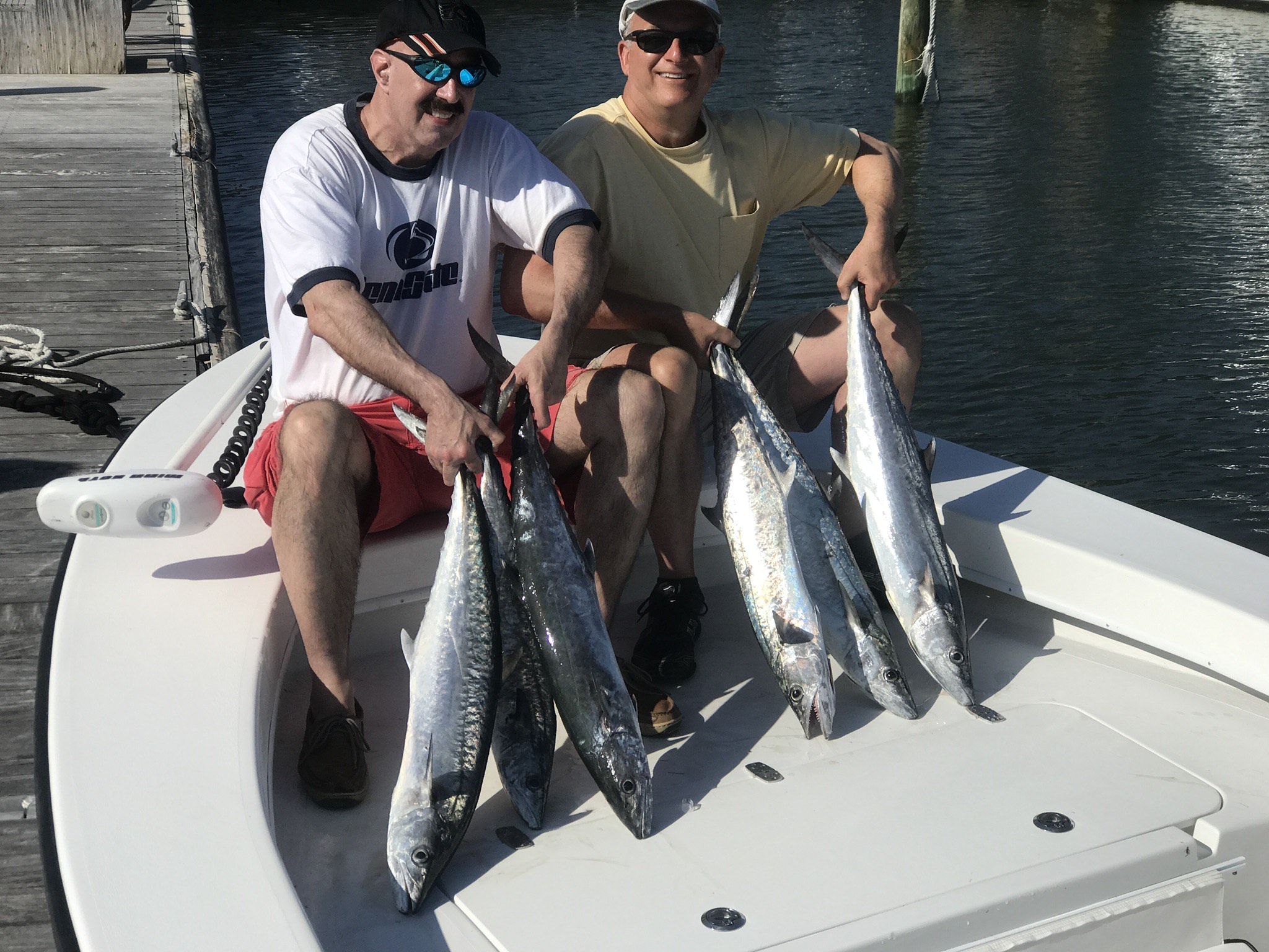 2 men showing their catch of fish caught in St Petersburg