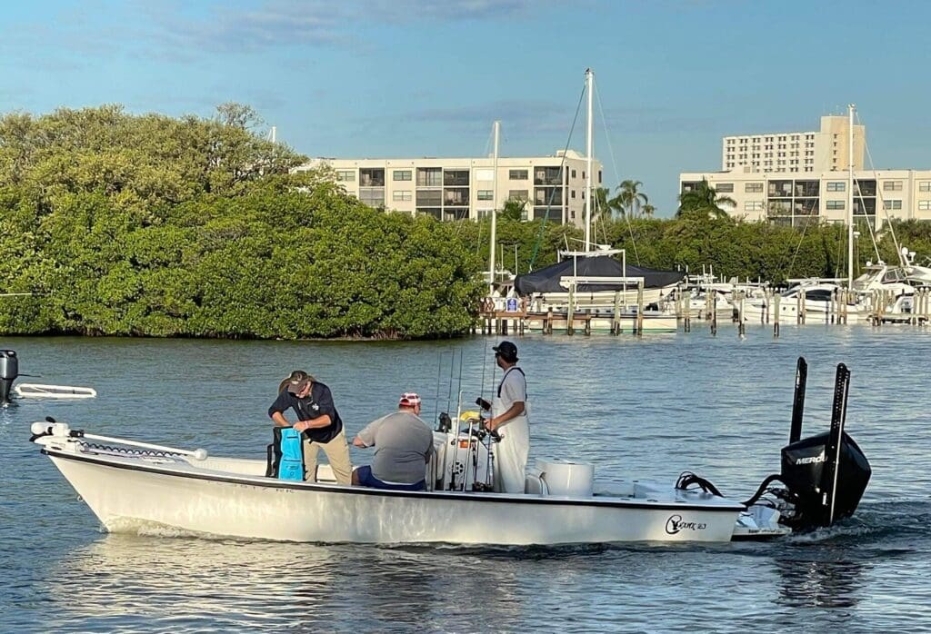 captain Spencer navigating his bay boat for a better inshore fishing spot